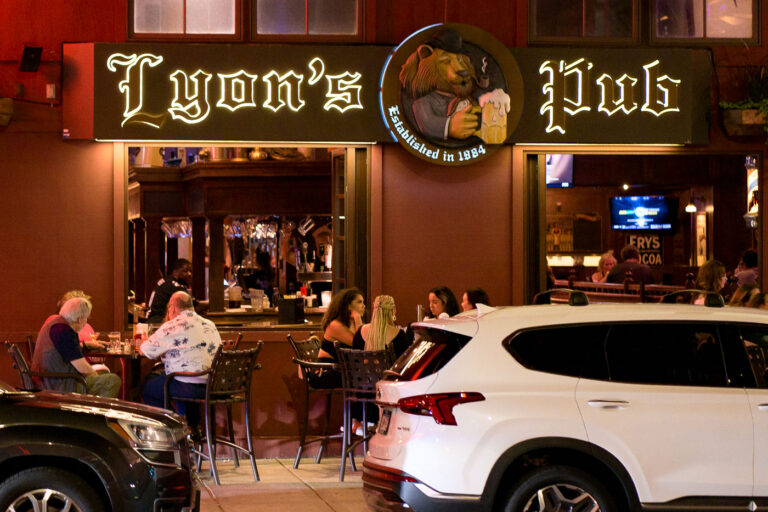 Lyon's Pub, Downtown Minneapolis Nightlife, July 2022 4 Lyon's Pub, established in 1984, is a long-standing establishment in downtown Minneapolis, known as a hub for the city's nightlife. The photograph, taken in July 2022, shows patrons gathered at the bar and outdoor seating. This period followed the 2020 Minneapolis Uprising, a significant event that reshaped the city's social and physical environment. Lyon's Pub continues to serve as a community gathering place amidst the ongoing recovery and development of the downtown area.