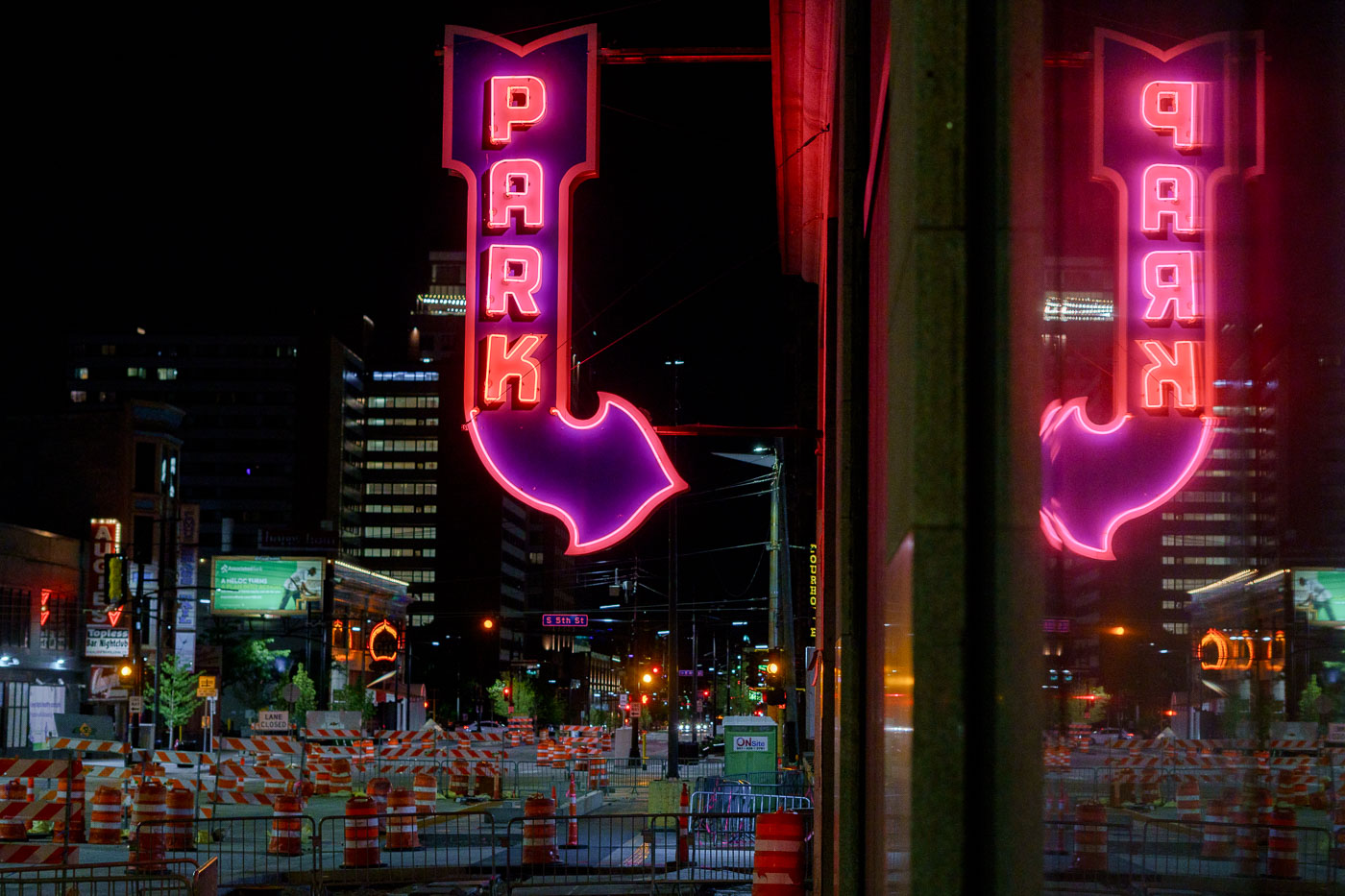 Reflected Neon “PARK” Sign on 5th Street, Minneapolis