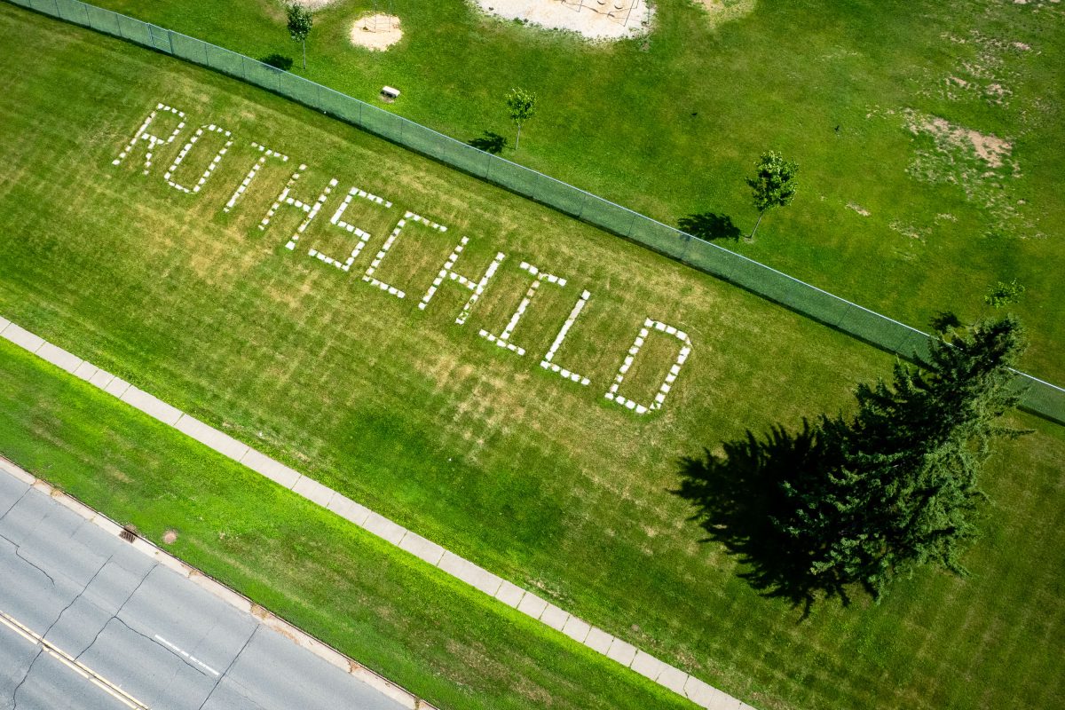 Rothschild Village Name Spelled Out in Lawn Lettering