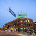 A biker at Hennepin Ave and Lake Street in Uptown Minneapolis during dusk.