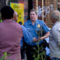 Interim Minneapolis Police Chief Huffman arrives at George Floyd Square for a "Community Conversation" on public safety. The forum was also attended by Hennepin County Attorney candidates.