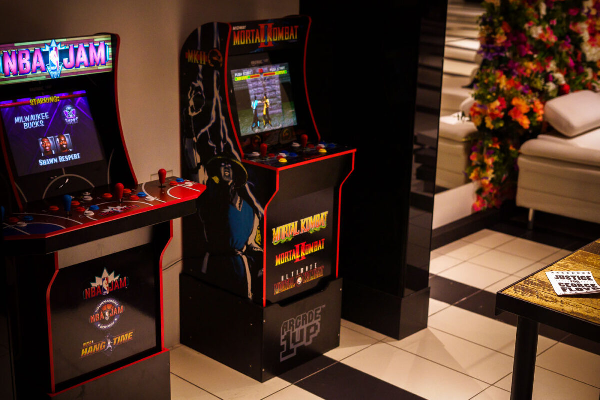 Arcade games inside Jughouse on Hennepin Ave in Uptown Minneapolis. Justice for George Floyd stickers on the table.