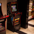 Arcade games inside Jughouse on Hennepin Ave in Uptown Minneapolis. Justice for George Floyd stickers on the table.