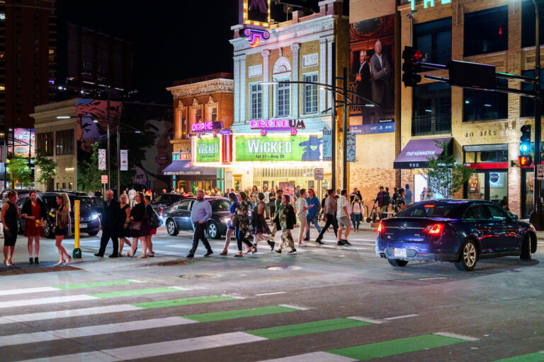 Crowds leaving Orpheum Theatre in Minneapolis 2 Crowds leave the Orpheum Theatre on Hennepin Ave in Downtown Minneapolis on a Friday night in August. 2022.