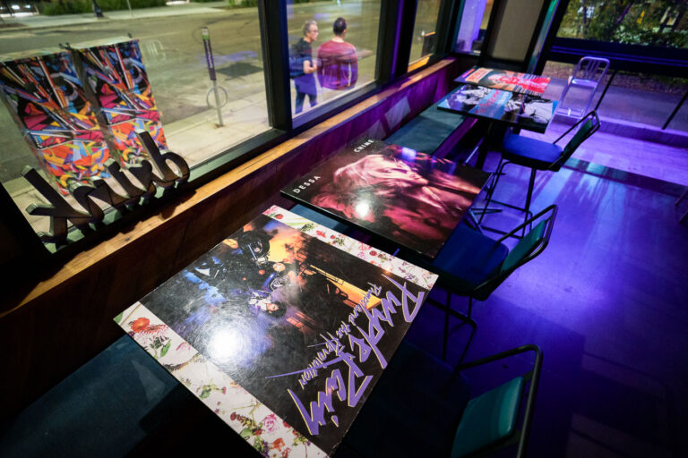 Moxy, Uptown Minneapolis 1 Purple Rain and Dessa album covers as tabletops in the Moxy Hotel on Lake Street in Uptown Minneapolis.