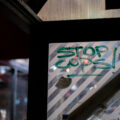 Stop Cops! written on a former bus shelter at George Floyd Square.