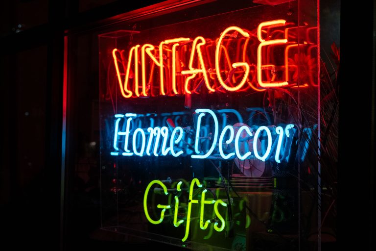 Vintage Home Decor Gifts Neon Sign, Minneapolis 1 Neon sign reading "Vintage Home Decor Gifts" outside a Minneapolis shop window.