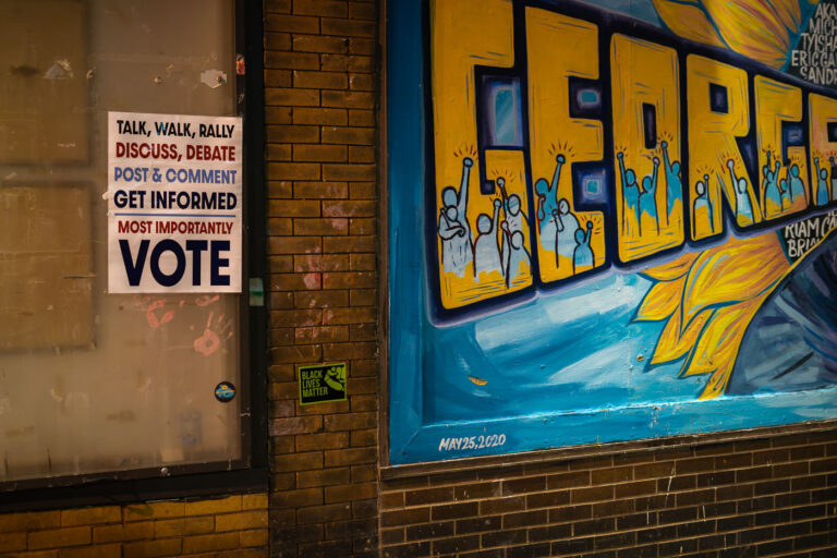 Vote sign at George Floyd Square in August 2022 2 As the city begins “Monthly learning tables” as part of its “38th & Chicago Re-Envisioned” project, more than a year after streets were reopened to vehicles, the ask from those at George Floyd Square continues to be the same as it has been since August 7, 2020: Meet the demands.