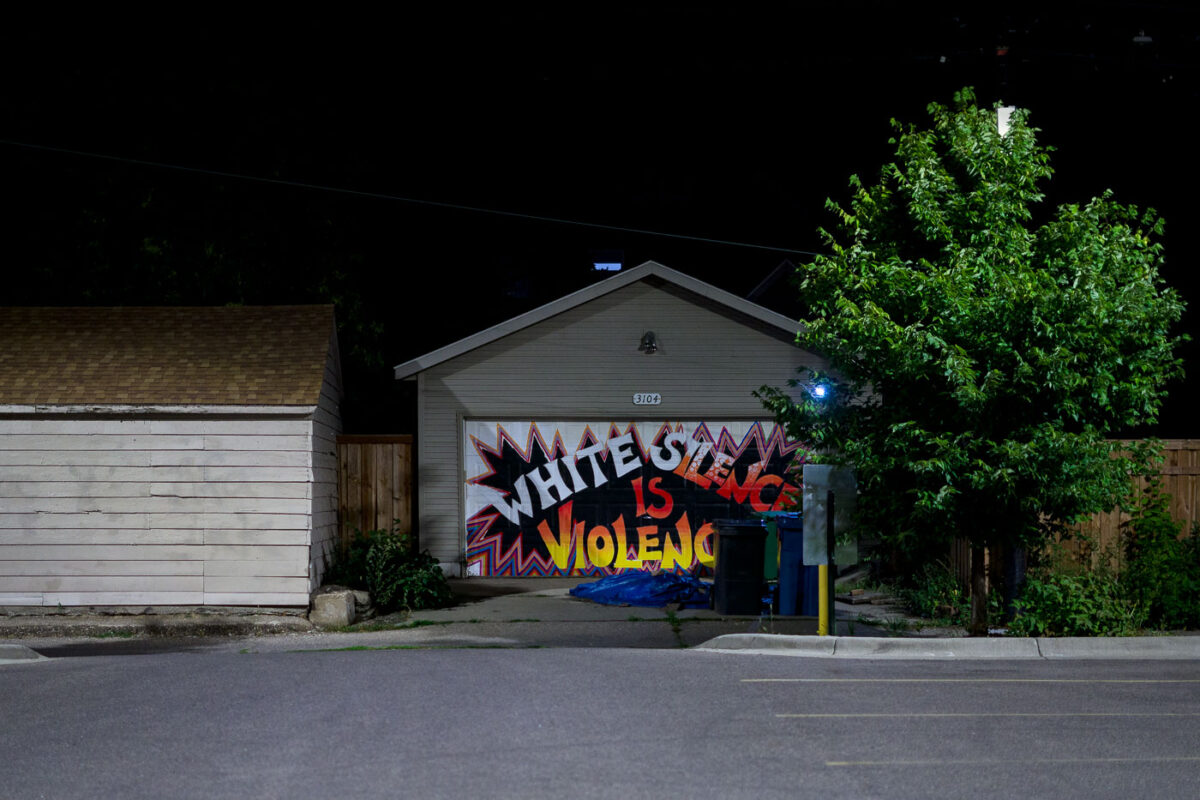 A mural in South Minneapolis with a mural that reads "White Silence is Violence”.