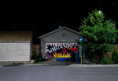 A mural in South Minneapolis with a mural that reads "White Silence is Violence”.