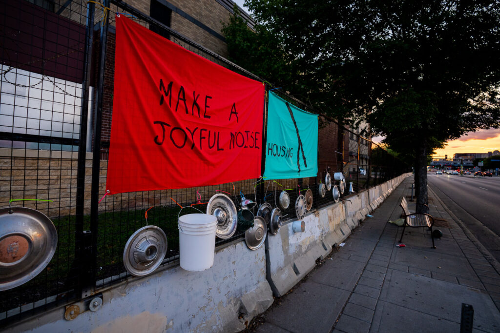 An art installation on the fencing around the Minneapolis Police Third Precinct. The Precinct was destroyed during riots following the murder of George Floyd.