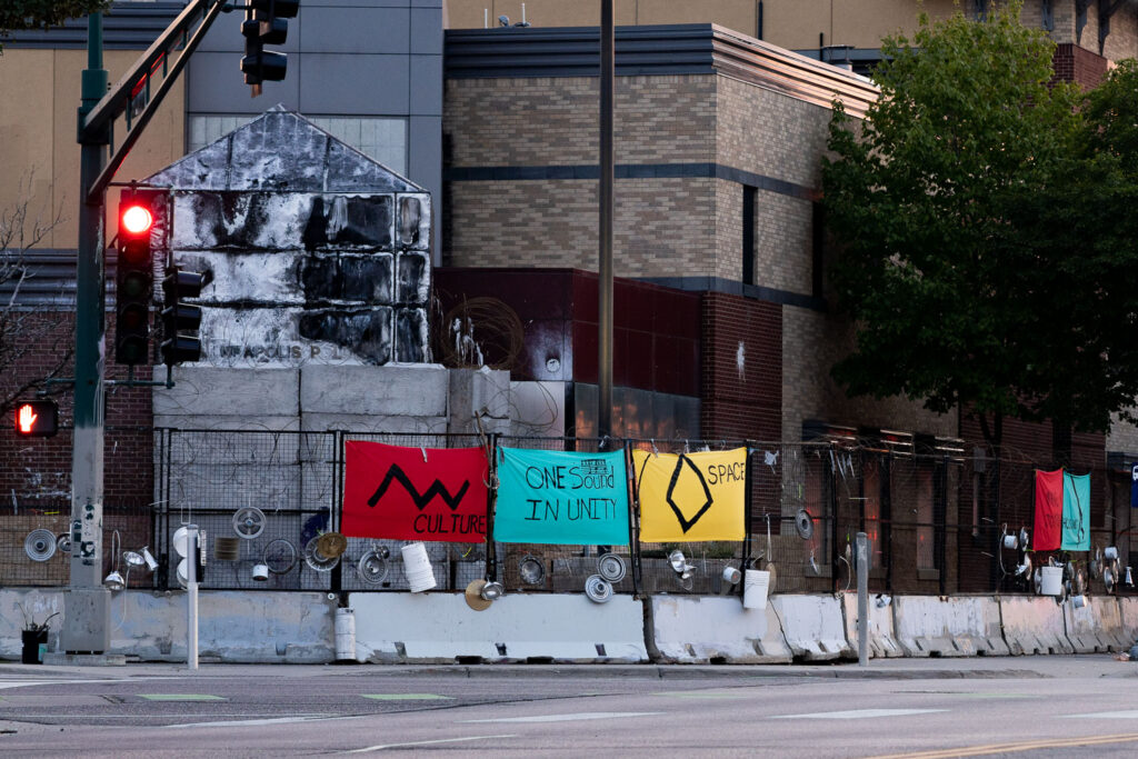 An art installation on the fencing around the Minneapolis Police Third Precinct. The Precinct was destroyed during riots following the murder of George Floyd.