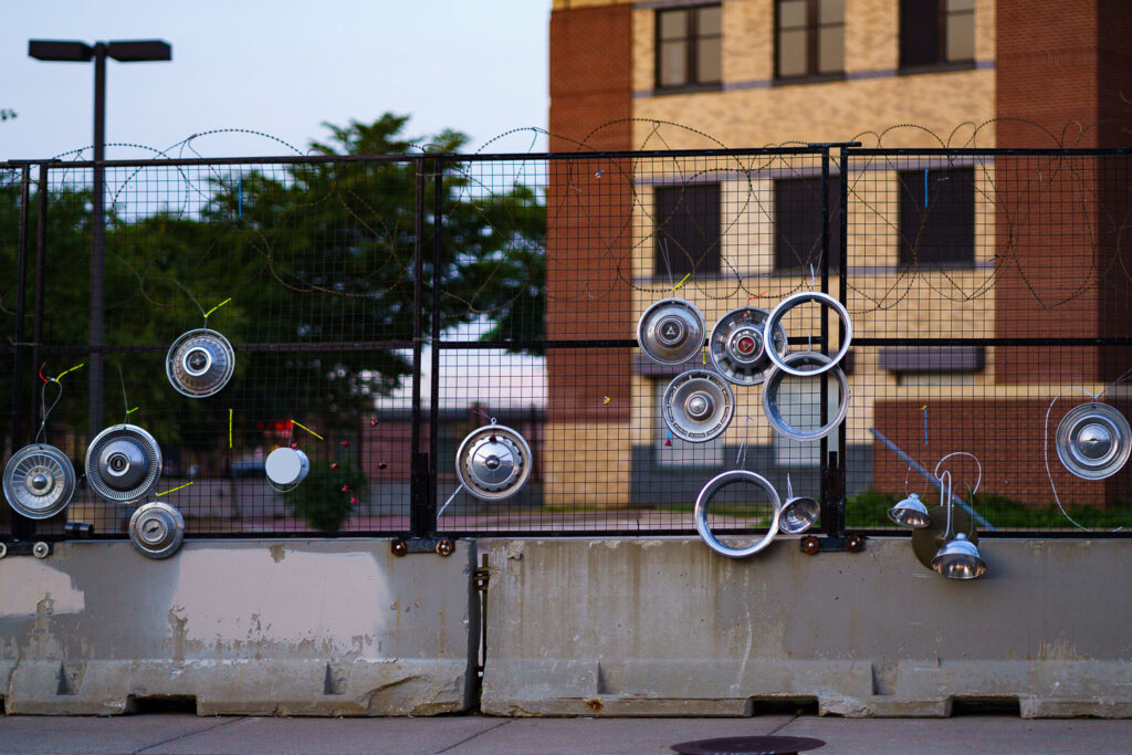An art installation on the fencing around the Minneapolis Police Third Precinct. The Precinct was destroyed during riots following the murder of George Floyd.