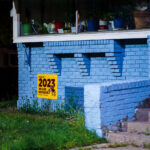 A "Class of 2023 We are Roosevelt" yard sign in a South Minneapolis front yard.