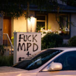 Graffiti on an electrical box in Uptown Minneapolis reading “FUCK MPD”