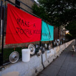 An art installation on the fencing around the Minneapolis Police Third Precinct. The Precinct was destroyed during riots following the murder of George Floyd.