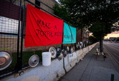An art installation on the fencing around the Minneapolis Police Third Precinct. The Precinct was destroyed during riots following the murder of George Floyd.