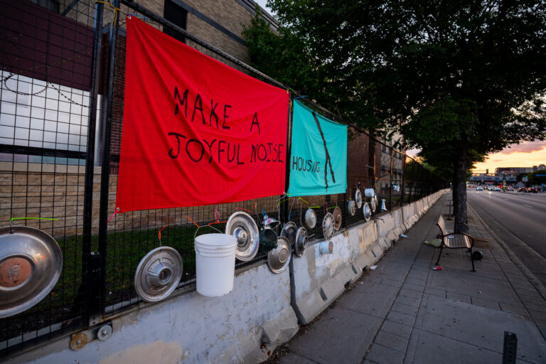 Make a Joyful Noise at Police Station 3 An art installation on the fencing around the Minneapolis Police Third Precinct. The Precinct was destroyed during riots following the murder of George Floyd.