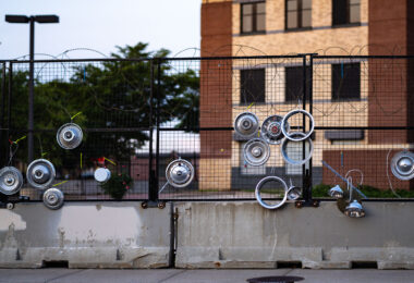 An art installation on the fencing around the Minneapolis Police Third Precinct. The Precinct was destroyed during riots following the murder of George Floyd.