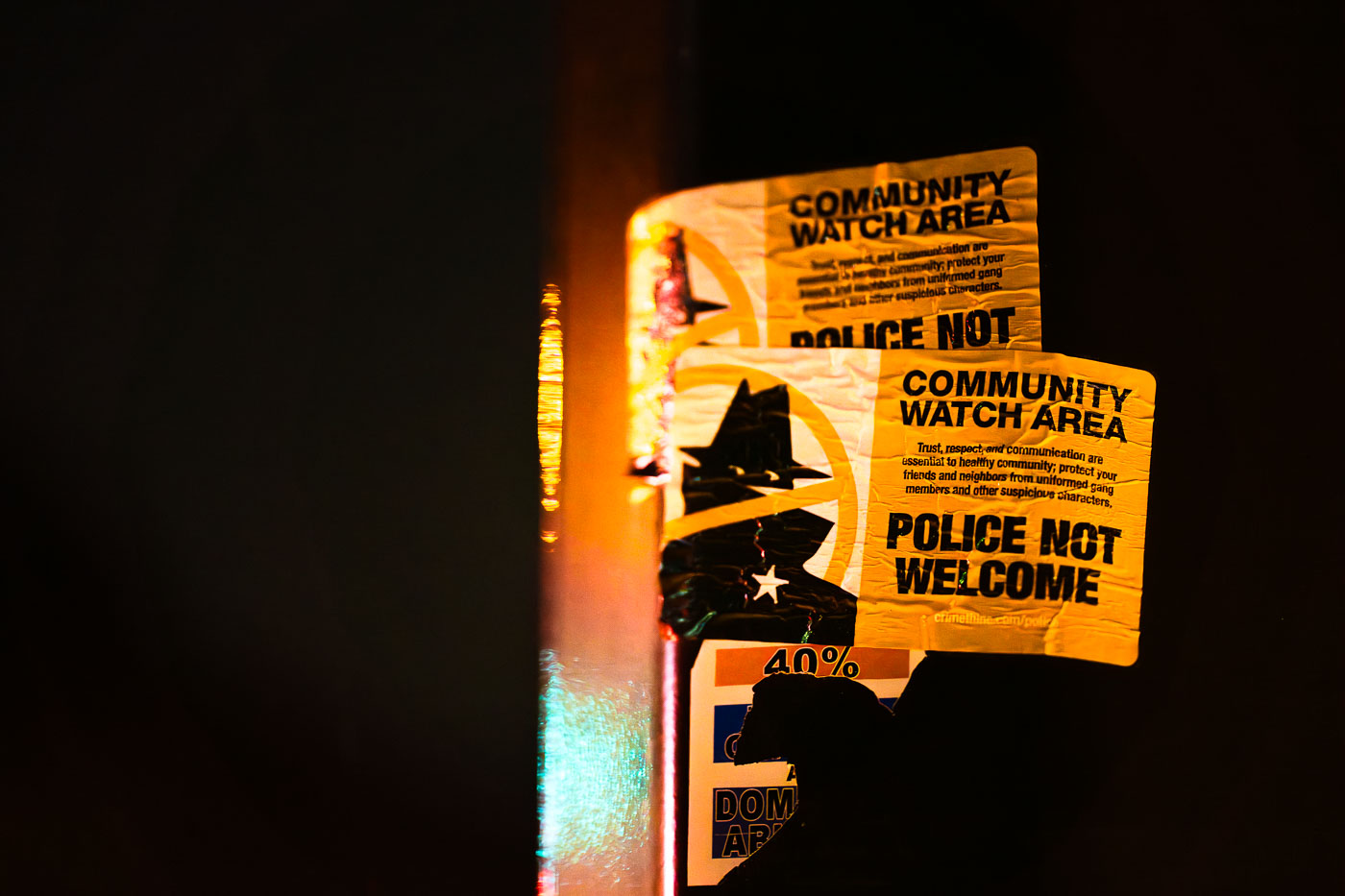 Police Not Welcome sticker on a pole