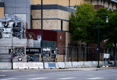 Minneapolis Police Third Precinct with art banners on the fencing. The precinct has been vacant since it was lit on fire during protests that followed the May 25th, 2020 murder of George Floyd.