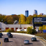 A billboard by a self described "leading public policy organization" at the I-94 Minneapolis border declares “It’s official” and directs motorists to a page where their interpretation of crime data shows crime rising years prior to the mass quitting of police officers in 2020-22.