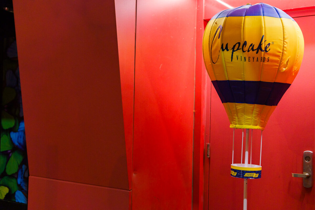 Cupcake Vineyards Display in a Red-Lit Entryway