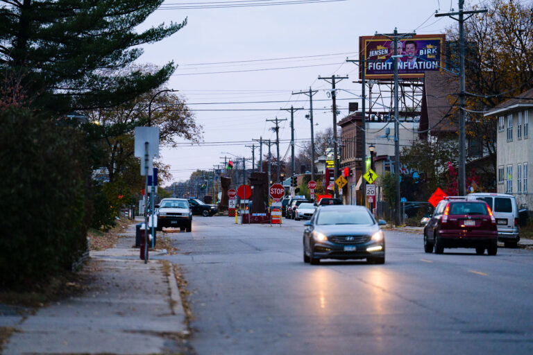 Scott Jensen Billboard Above George Floyd Square Mural 2 A billboard featuring Scott Jensen and Matt Birk, candidates for Minnesota Governor, is positioned directly above the George Floyd mural at George Floyd Square in Minneapolis. The billboard, which reads "FIGHT INFLATION," was erected during the 2022 election cycle. George Floyd Square, located at the intersection of 38th Street and Chicago Avenue, became a focal point of protests and activism following the murder of George Floyd in May 2020. The area has since been transformed into a memorial and community space, often marked by art and symbolic structures.