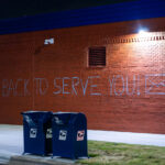 "We are back to serve you!" written on the side of the newly opened Lake Street Station. The post office was burned down during protests that followed the May 25th, 2020 murder of George Floyd.
