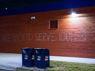 Lake Street Post Office Reopens with Graffiti Message
