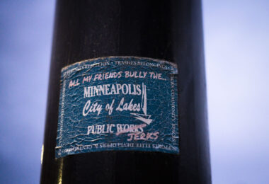 "All my friends bully the Minneapolis Public Works(Jerks)" sticker on a light pole. In response to Public Works participating in encampment clearings.