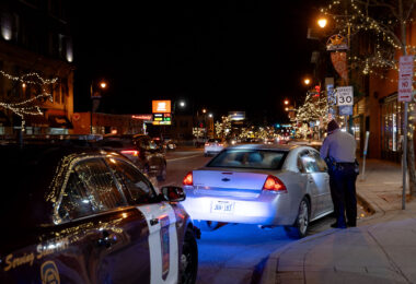 Minnesota State Patrol and a pulled over vehicle with a dog in the window. The Minnesota State Patrol was assisting Minneapolis Police.