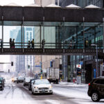 Outside the IDS Center in downtown Minneapolis during the first snowfall of the season.
