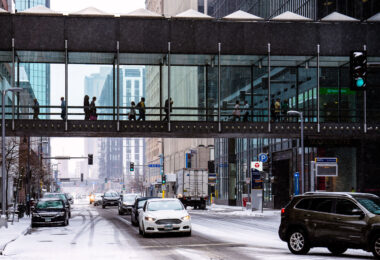 Outside the IDS Center in downtown Minneapolis during the first snowfall of the season.