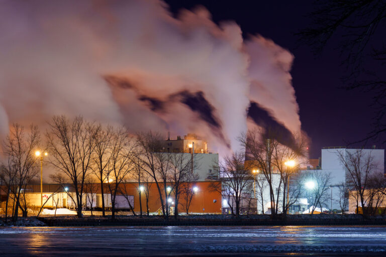 Green Bay Packaging Mill on the Fox River 1 Green Bay Packaging’s state-of-the-art recycled paper mill, completed in 2021 at a cost of roughly 0 million, releases plumes of steam into the winter night as viewed from across the Fox River. The facility replaced the company’s 72-year-old mill and became one of the most advanced recycled-paper operations in the country, designed to dramatically reduce water use and energy consumption while increasing production capacity. The glow from the mill’s lighting and processing equipment diffuses through the cold air, mingling with tree silhouettes along the riverbank and reflecting off the frozen surface of the Fox River.