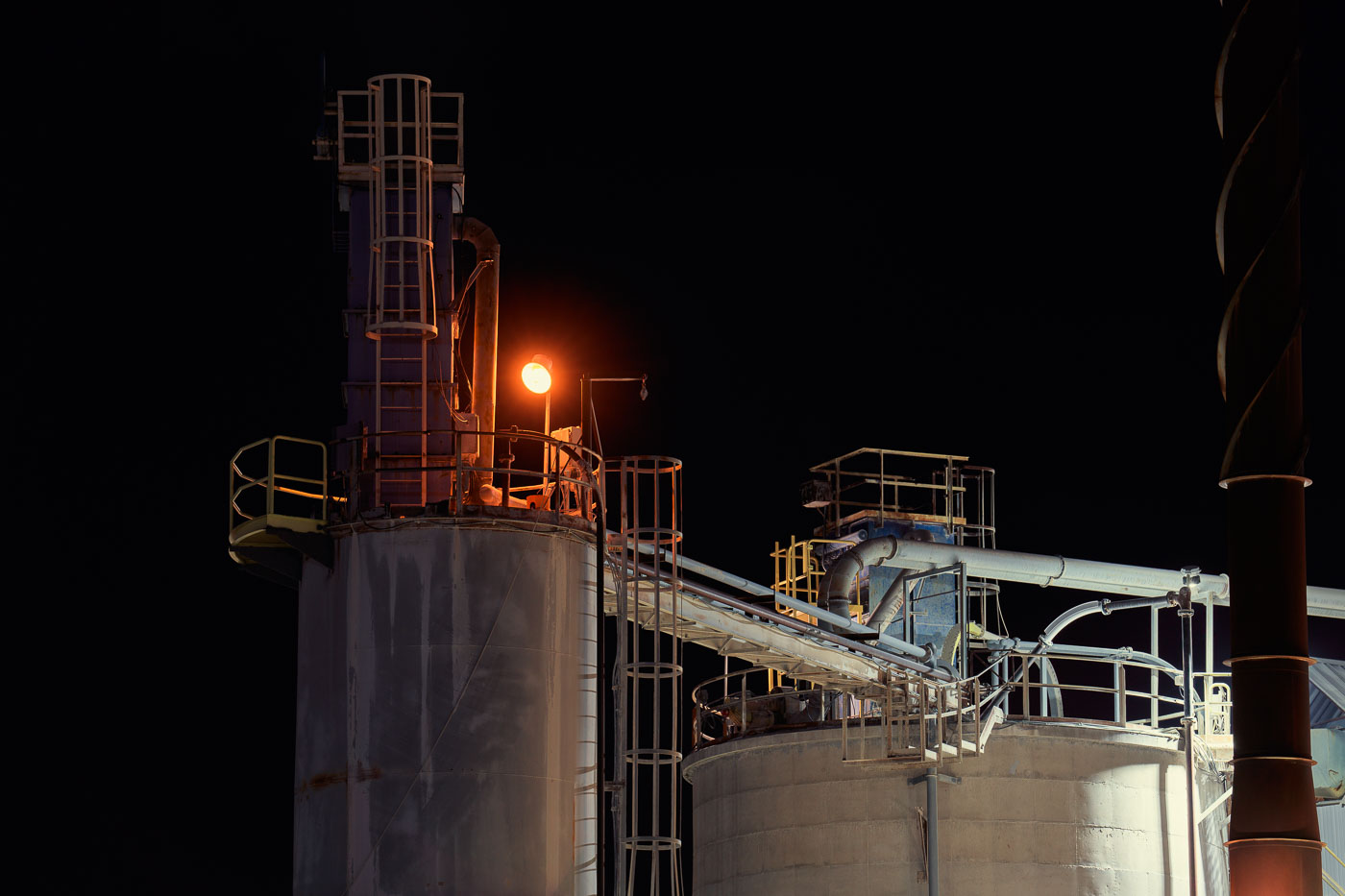 Lime Silos and Transfer Systems at Night