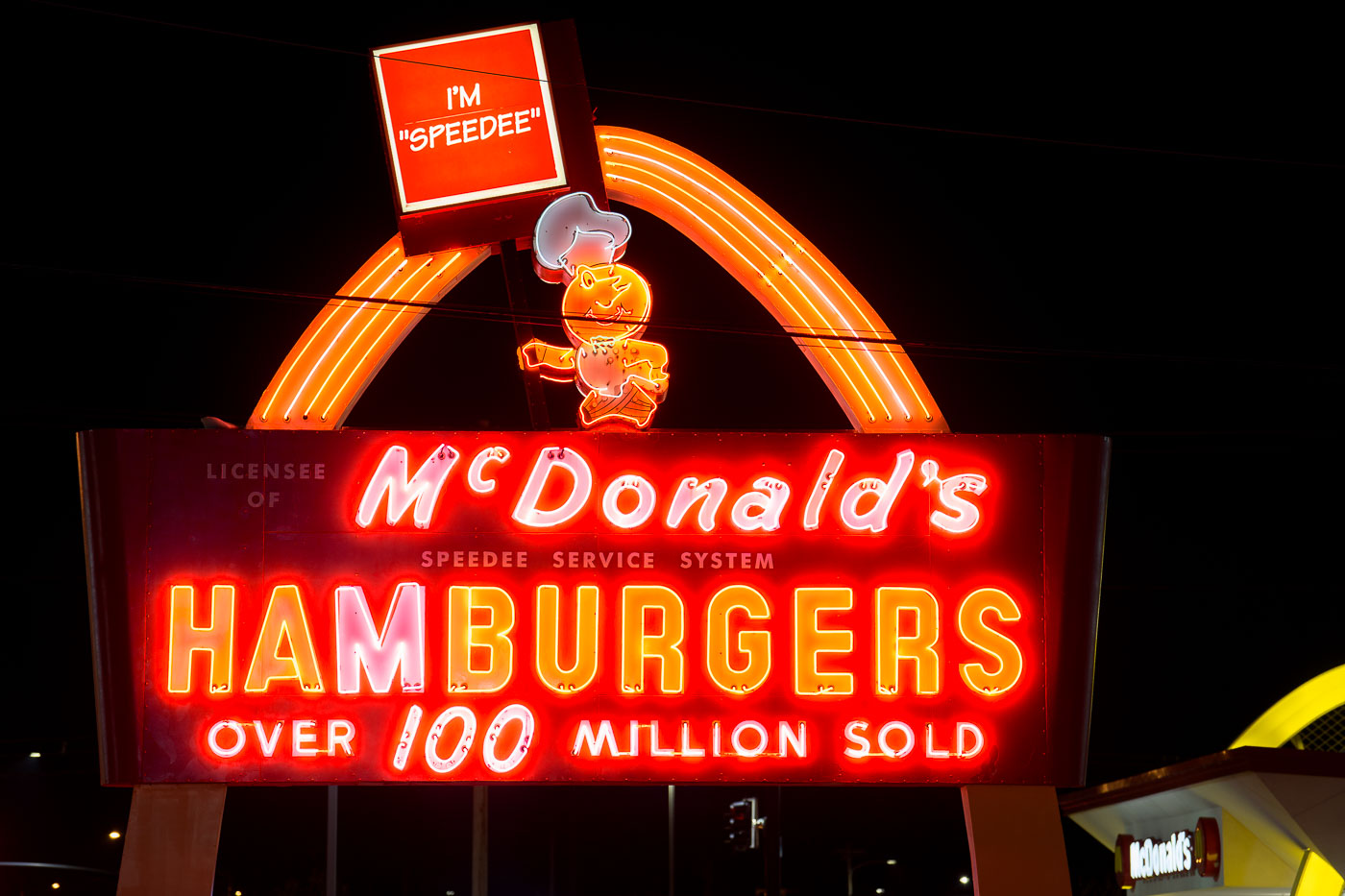Neon McDonalds sign at night