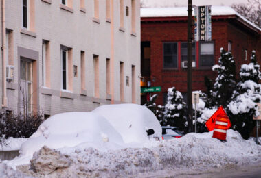 Cars under the snow following a 14" snowfall in Uptown Minneapolis.