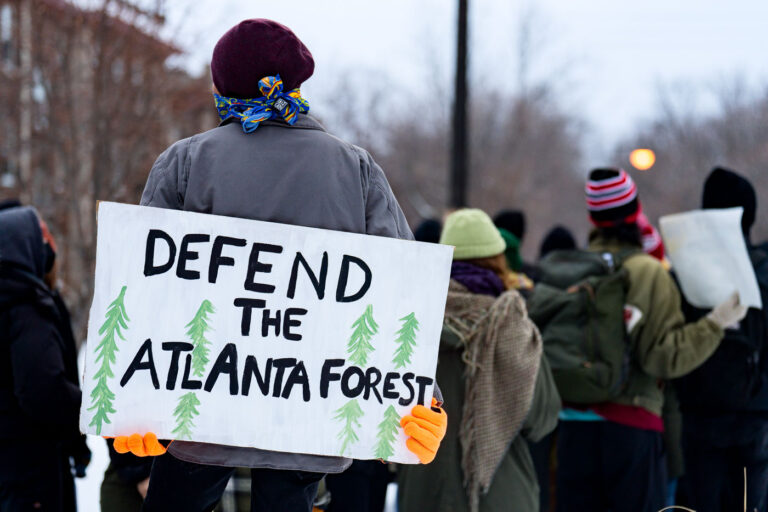 Defend The Atlanta Forest Protest Sign 4 Protesters marching in Minneapolis near Hennepin/Lake remembering Manuel Teran(Tort), who was shot and killed by officers at a prolonged protest in an Atlanta forest after they say he fired upon them. They stopped at Lake/Girard where protester Deona Marie was killed on 06/13/21.