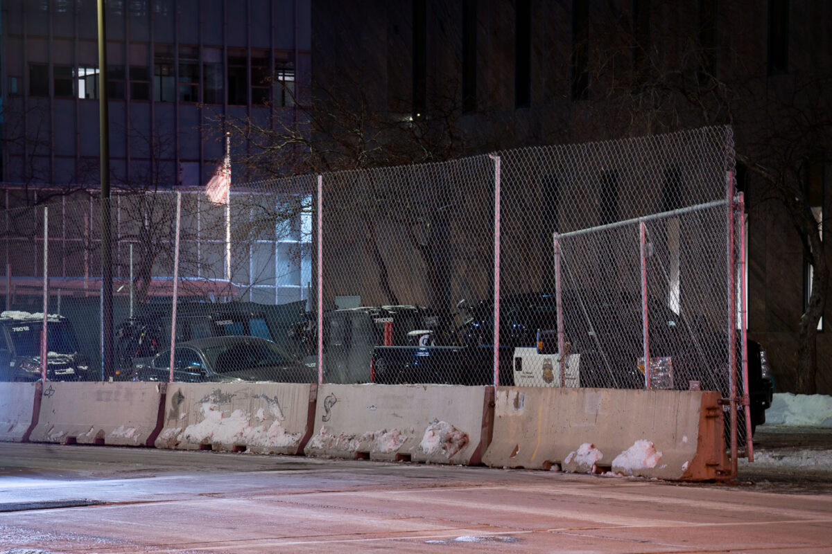 Minneapolis police vehicles parked outside a barricaded temporary third precinct on January 28, 2023. The temporary precinct is due to the original third precinct being burned on May 28th, 2020.
