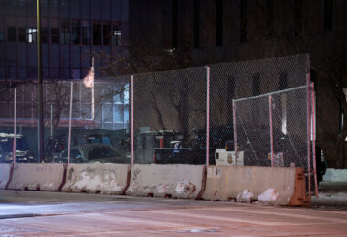Minneapolis police vehicles parked outside a barricaded temporary third precinct on January 28, 2023. The temporary precinct is due to the original third precinct being burned on May 28th, 2020.