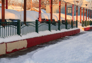 Snow covering cars at a dealership on Lake Street in Minneapolis on January 7, 2023.
