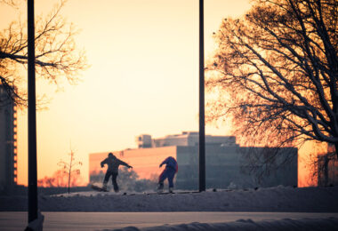 Snowboarders in Minneapolis after a large snowfall.
