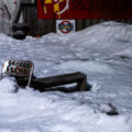A chair with "George Floyd" written on it in the snow at Say Their Names Cemetery on February 18, 2023.