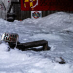 A chair with "George Floyd" written on it in the snow at Say Their Names Cemetery on February 18, 2023.