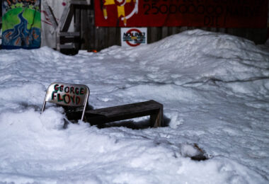 A chair with "George Floyd" written on it in the snow at Say Their Names Cemetery on February 18, 2023.