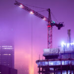 Foggy night with construction cranes in Downtown Minneapolis.