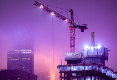 Foggy night with construction cranes in Downtown Minneapolis.
