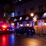 Minneapolis Police parked outside Fire House bar/restaurant in Uptown Minneapolis.Graffiti that reads “No Good cops. No bad protesters”
