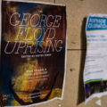 A flyer for "The George Floyd Uprising" book by "Vortex Group" seen at George Floyd Square on February 18, 2023.